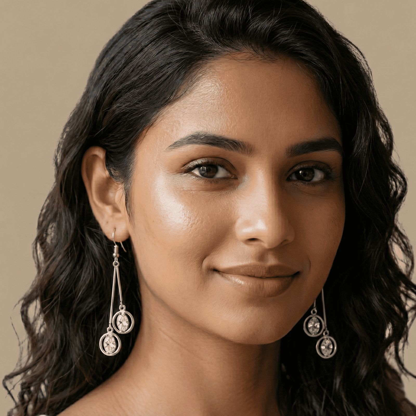Women wearing 3D silver crystal drop earrings