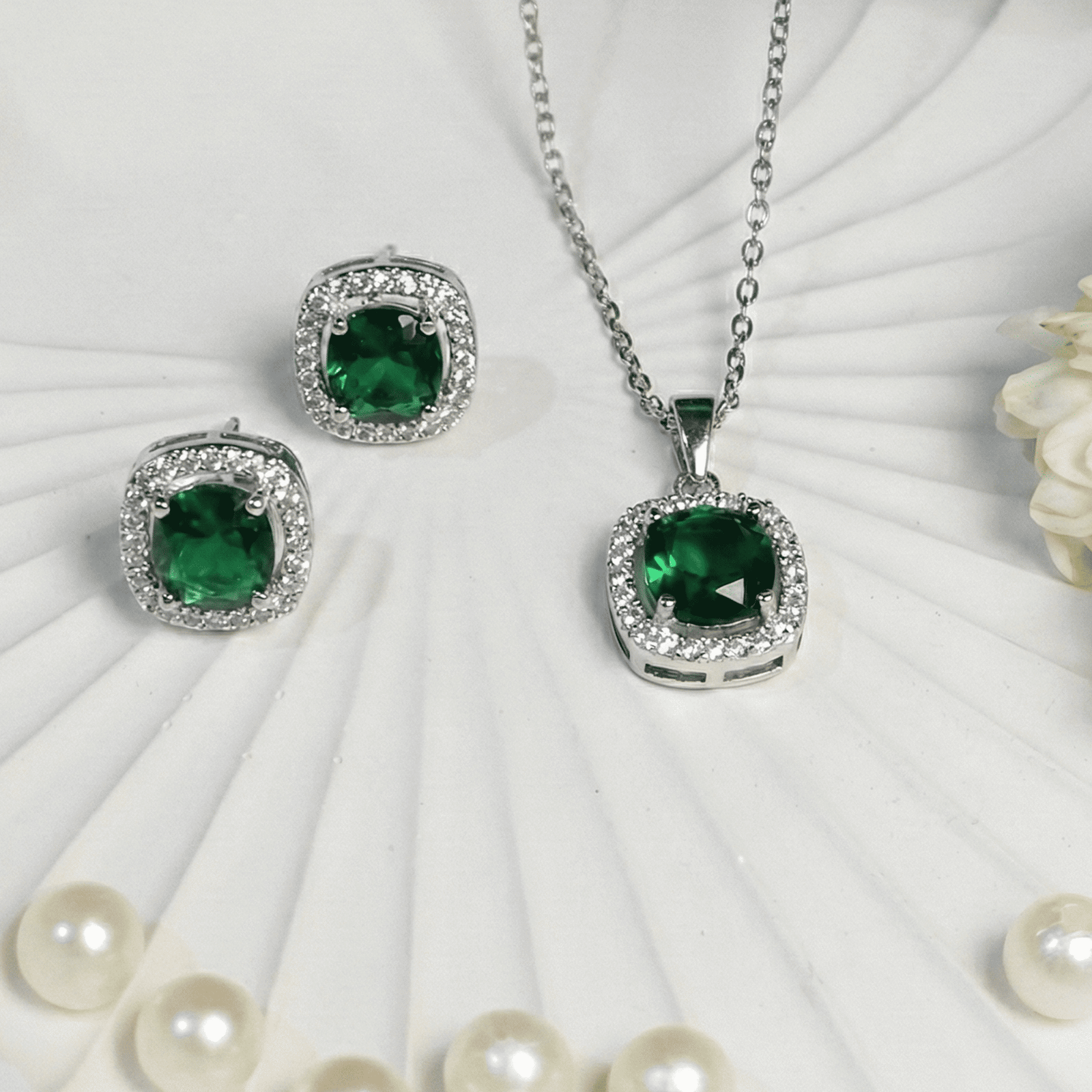 Contemporary emerald AD pendant jewellery set with earrings close up