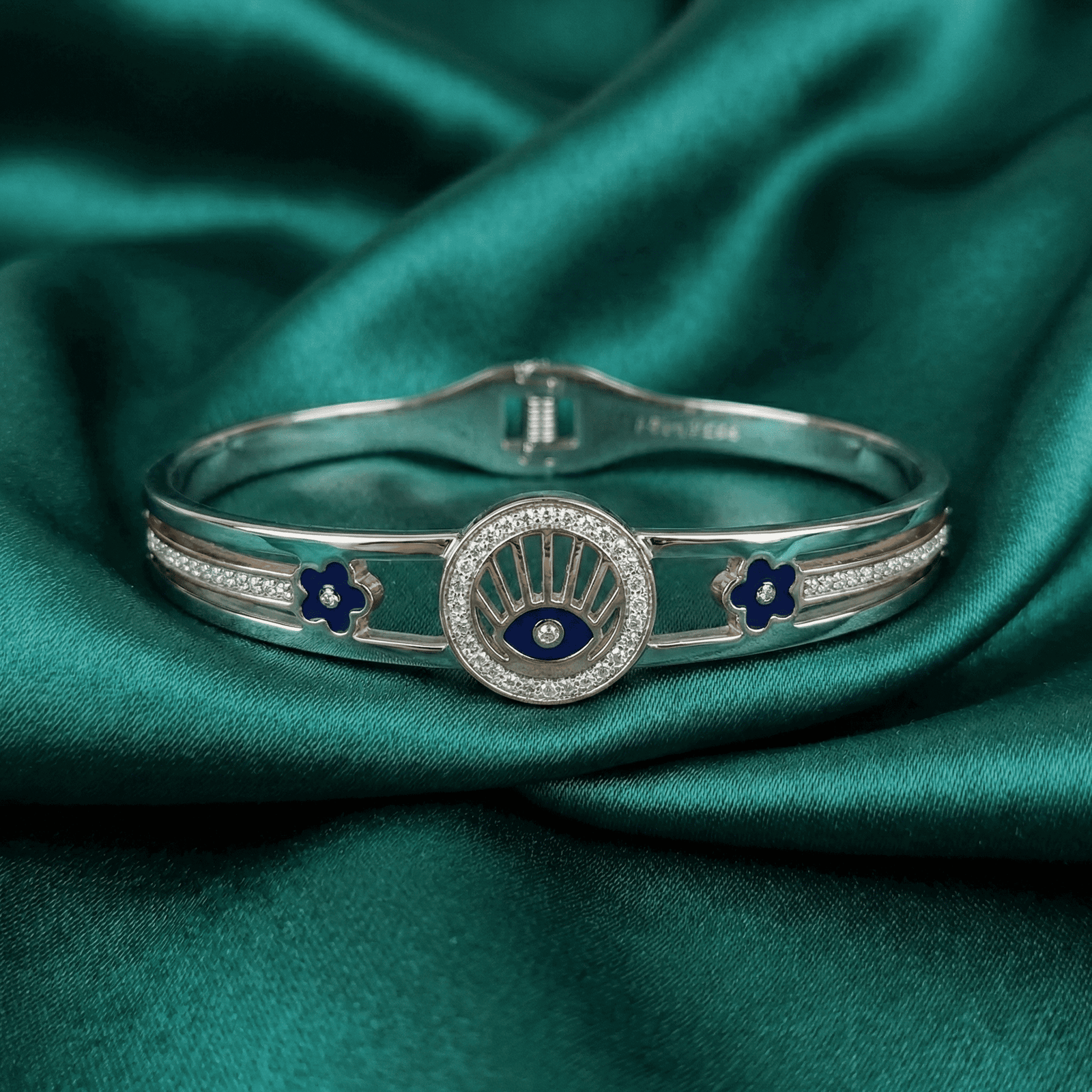 Silver tone evil eye floral bracelet with zircon stones
