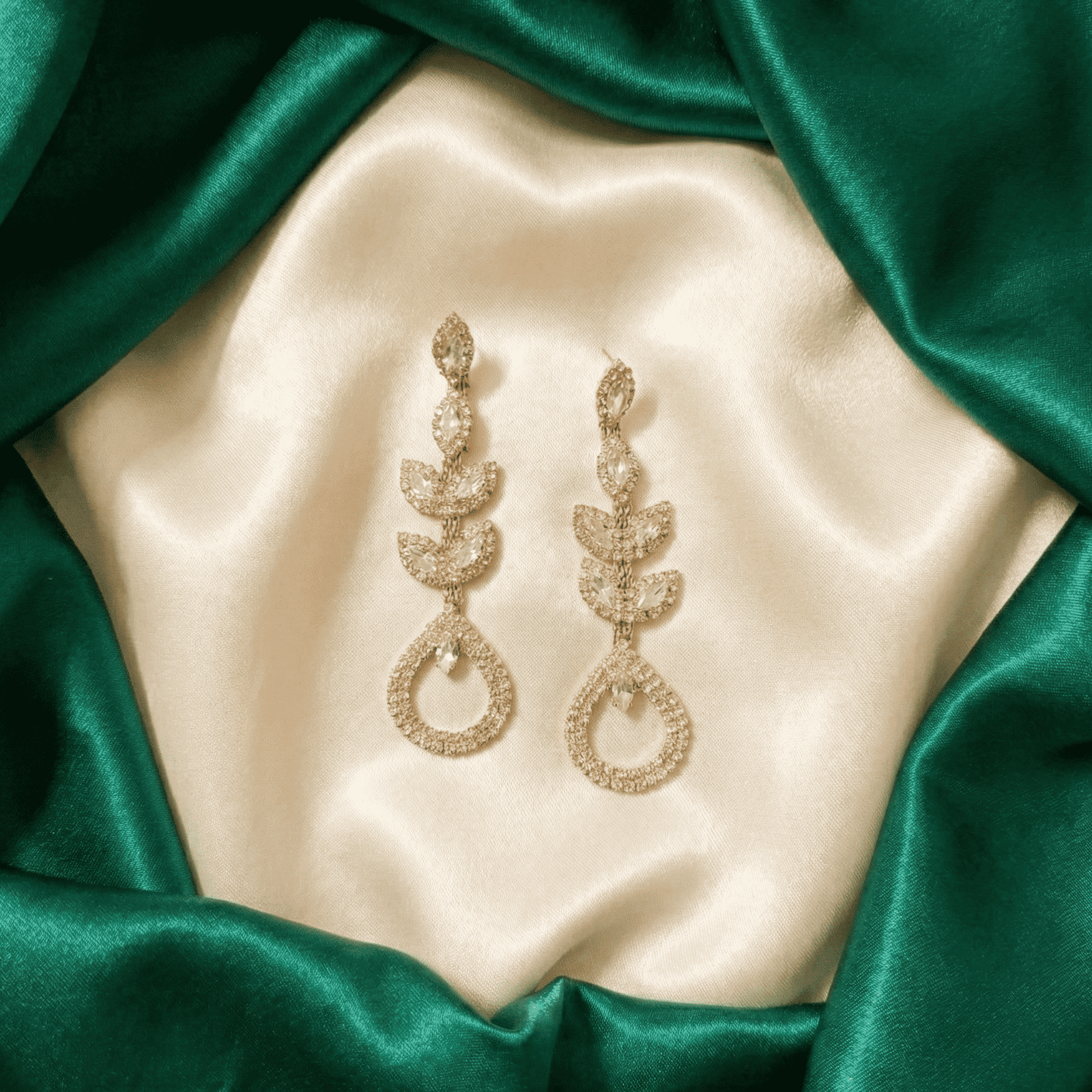 Long crystal vine earrings with sparkling pear drop design