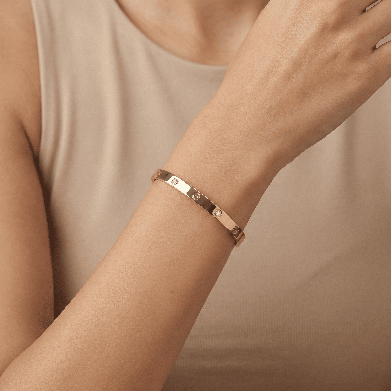 Women wearing gold-tone zircon anti-tarnish bracelet by Eshanarya