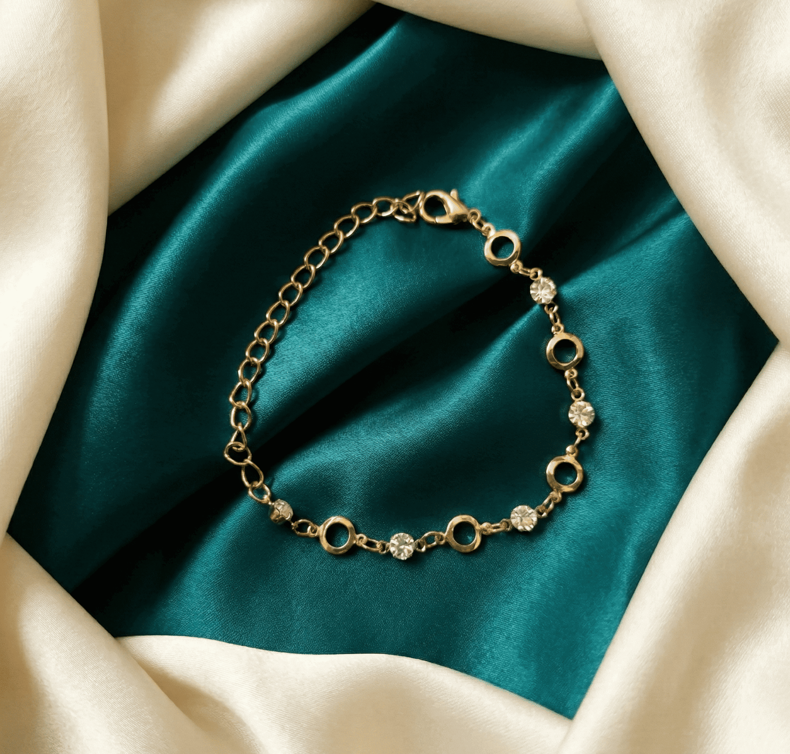 Gold-tone crystal link fashion bracelet for women on satin fabric