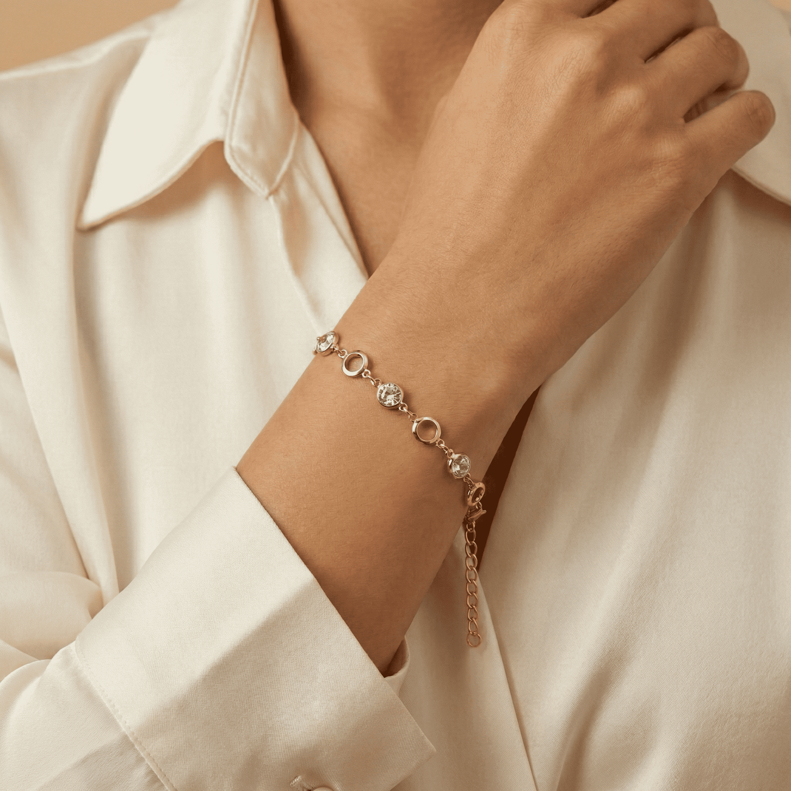 Women wearing Eshanarya gold-tone crystal link bracelet