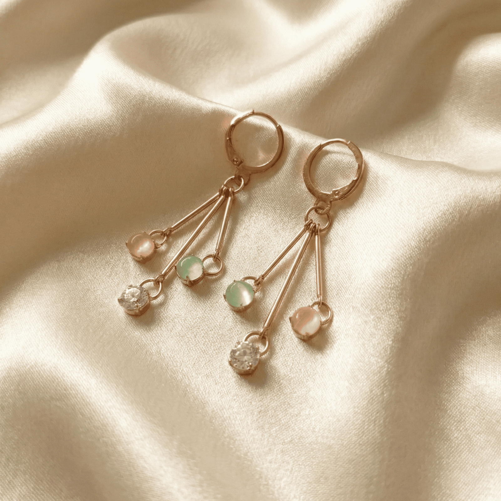 Modern gold tone pastel drop earrings with sparkling crystal stones