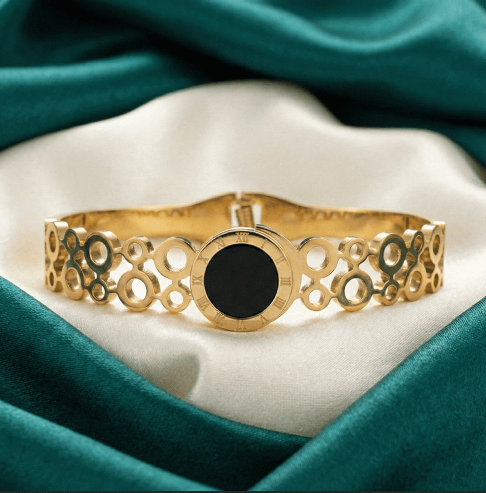 Close-up side angle of gold tone stainless steel circular link bracelet for women