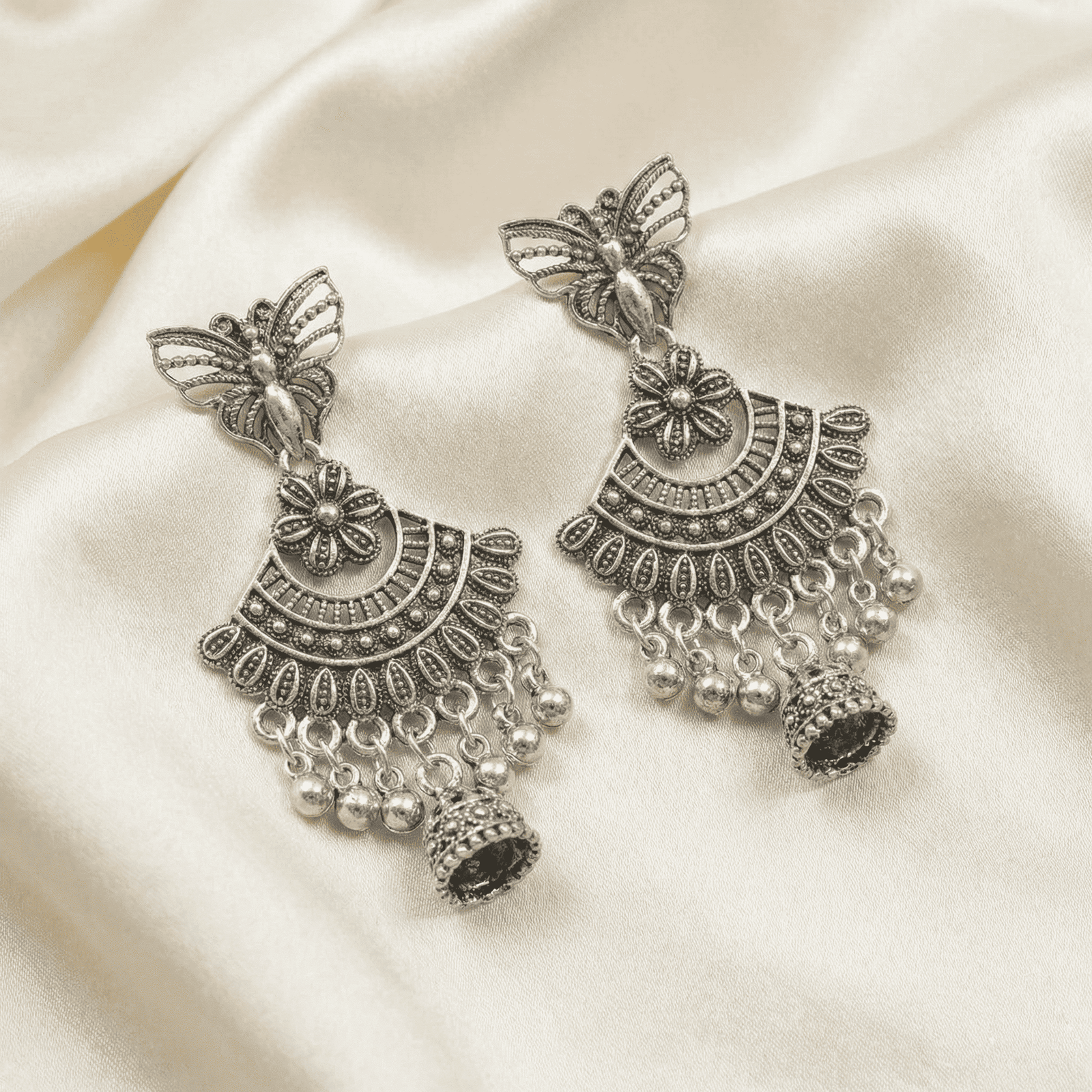 Ethnic oxidised silver butterfly earrings with bead danglers and miniature jhumka charms for festive wear