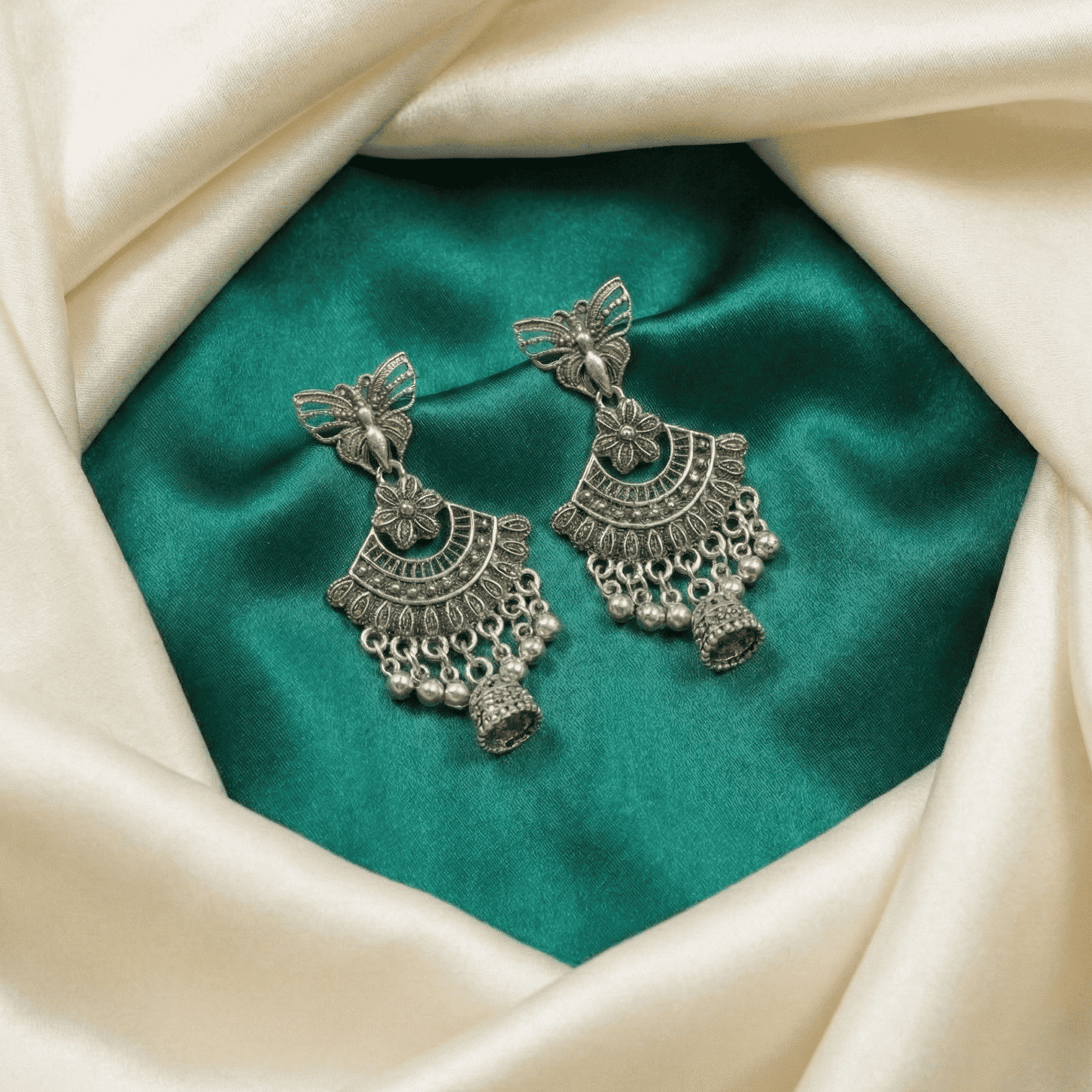 Traditional oxidised silver butterfly jhumka earrings for women with intricate floral chandbali design