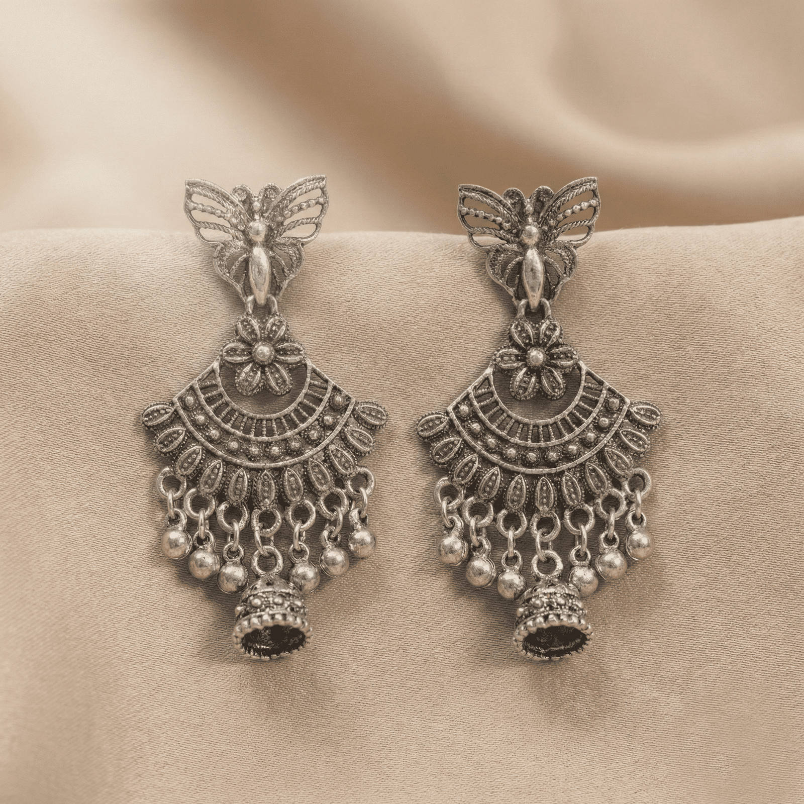 Lightweight oxidised silver butterfly jhumka earrings with antique finish and decorative dangling beads