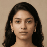 Woman wearing silver tone teardrop earrings