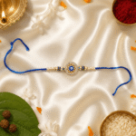 Blue Evil Eye Designer Rakhi with crystal round centerpiece, pearl beads and blue thread for Raksha Bandhan by Eshanarya