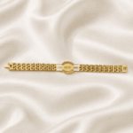 Eshanarya Radhe Radhe Gold Finish Bracelet Rakhi for Brother displayed on an off-white satin background with a minimalist bracelet design.
