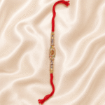 Eshanarya BRO Crystal Designer Rakhi with pearl beads and colourful decorative beads on off-white satin background