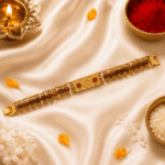 Premium Om bracelet rakhi with rudraksha beads displayed with traditional Raksha Bandhan decorations and festive props