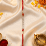 Premium Raksha Bandhan crystal Rakhi photographed with traditional festive decorations