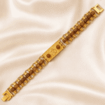 Angled view of Om Rudraksha bracelet rakhi featuring gold-tone centre plate with Om symbol and natural rudraksha beads