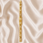 Vertical view of Eshanarya Om Bracelet Rakhi featuring a crystal-studded Om symbol and gold finish geometric bracelet links