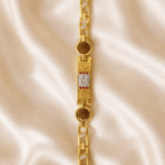 Top view of Eshanarya Om Rudraksha Bracelet Rakhi featuring a silver Om motif, gold finish links and natural Rudraksha beads for Raksha Bandhan.