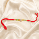Horizontal view of handcrafted gold crystal Rakhi with colourful bead detailing for Raksha Bandhan