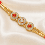 Close-up of Triple Crystal Floral Designer Rakhi featuring crystal floral motifs and gold detailing