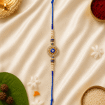 Handcrafted Evil Eye Rakhi for brother with blue beads, pearl accents and crystal circular motif for Raksha Bandhan