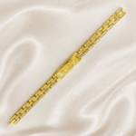 Angled view of Eshanarya gold-tone Bracelet Rakhi with textured engraved centre plate on soft satin fabric