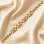 Angled view of Eshanarya gold finish Bracelet Rakhi with geometric links and sparkling crystal detailing.