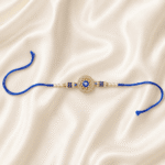 Premium Blue Evil Eye Rakhi featuring crystal embellished centerpiece with pearl and blue bead detailing