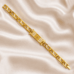 Designer Om Bracelet Rakhi by Eshanarya with gold finish chain links and crystal-studded Om centrepiece