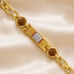 Detailed view of Eshanarya Om Rudraksha Bracelet Rakhi showcasing the silver Om centerpiece, gold finish frame and beautiful bracelet design.