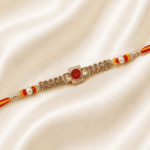 Close-up of red crystal centerpiece with sparkling stone chain designer rakhi