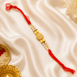 Eshanarya Crystal Pearl Designer Rakhi placed with festive pooja decor for Raksha Bandhan celebration