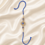 Minimalist Evil Eye Rakhi for men with blue thread, pearl beads and sparkling crystal round charm