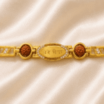 Close-up of Eshanarya Mere Bhai Bracelet Rakhi featuring engraved Hindi centreplate, Rudraksha beads and sparkling crystal detailing