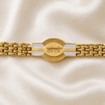 Close-up of the Eshanarya Radhe Radhe Bracelet Rakhi highlighting the engraved Radhe Radhe centrepiece with dual-tone detailing.