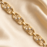 Close-up of Eshanarya geometric Bracelet Rakhi highlighting crystal accents and dual-tone pyramid pattern.