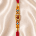 Close-up of Swastik crystal centrepiece designer rakhi with decorative floral accents