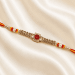 Detailed view of premium crystal designer rakhi with pearl accents and red stone