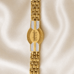 Vertical close-up of Eshanarya Gold Finish Bracelet Rakhi featuring the Radhe Radhe engraved centre design and polished chain.