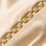 Detailed macro view of Eshanarya gold Bracelet Rakhi featuring textured geometric motifs and crystal embellishments.