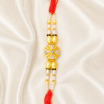 Close-up of Eshanarya Crystal Pearl Designer Rakhi showcasing crystal stone centrepiece and pearl bead craftsmanship