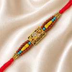 Premium Mahakal Designer Rakhi with crystal centrepiece displayed on satin fabric