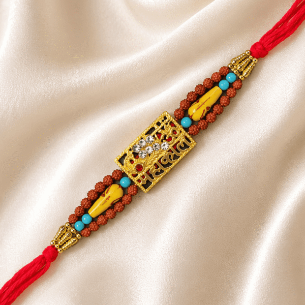 Premium Mahakal Designer Rakhi with crystal centrepiece displayed on satin fabric