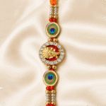 Front view of Lord Ganesha Peacock Feather Rakhi with crystal-studded circular motif