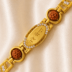 Close-up angled view of Eshanarya Mere Bhai Bracelet Rakhi featuring engraved Hindi centreplate, Rudraksha beads and crystal detailing