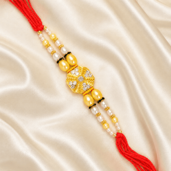 Luxury Crystal Pearl Designer Rakhi for Brother displayed on satin fabric with festive styling