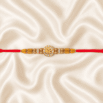 Lord Ganesha Designer Rakhi displayed with festive diya, kumkum and marigold flowers for Raksha Bandhan