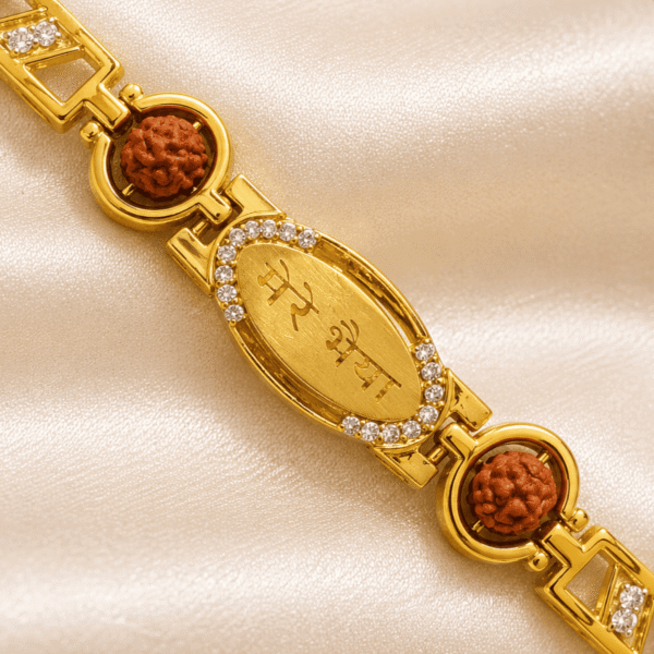 Detailed view of Eshanarya gold finish Mere Bhai Bracelet Rakhi with Rudraksha accents, crystal border and minimalist bracelet design
