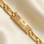 Detailed close-up of Eshanarya devotional Bracelet Rakhi with Jai Mata Di engraving and polished bracelet links.