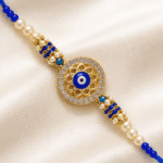 Premium handmade Evil Eye Rakhi with blue thread, crystal round charm and decorative pearl beads