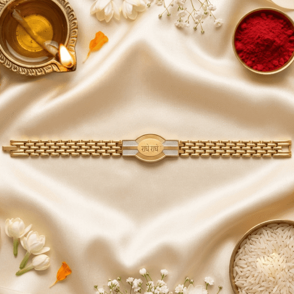 Festive flat lay of the Eshanarya Radhe Radhe Bracelet Rakhi with diya, kumkum, rice and white flowers for Raksha Bandhan.